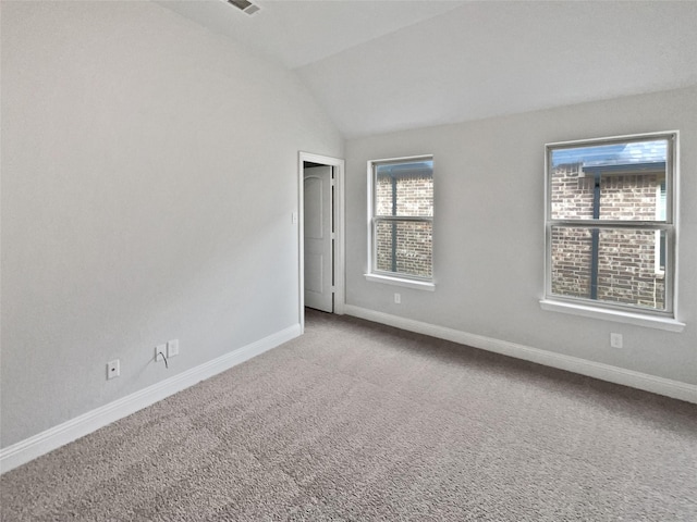 312 Canadian Ln, Burleson, TX 76028 - spare room featuring baseboards, carpet flooring, and vaulted ceiling