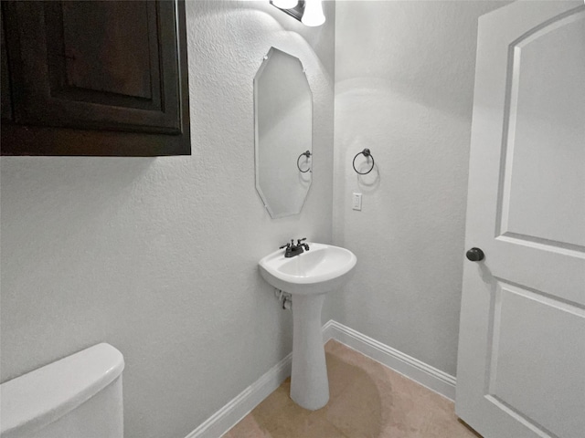 312 Canadian Ln, Burleson, TX 76028 - half bathroom with toilet, baseboards, and tile patterned flooring
