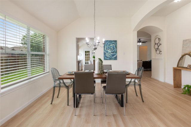 9716 Meadow Creek Dr, Denton, TX 76226 - dining room featuring healthy amount of natural light, light wood finished floors, a chandelier, arched walkways, and lofted ceiling
