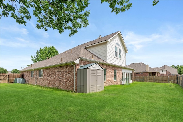 9716 Meadow Creek Dr, Denton, TX 76226 - back of property with brick siding, a shed, roof with shingles, an outbuilding, and cooling unit