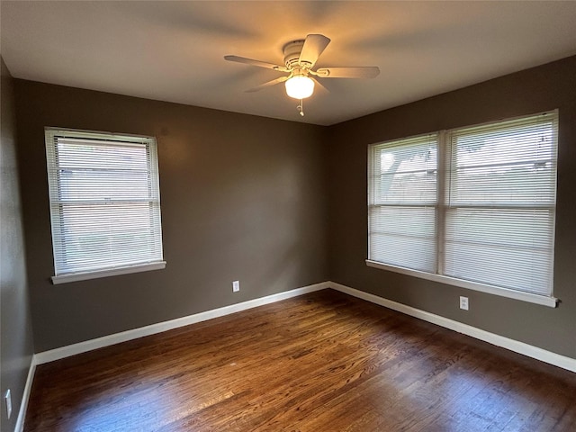 5004 Haywood Pkwy, Dallas, TX 75232 - empty room with dark wood-style floors, baseboards, and a ceiling fan