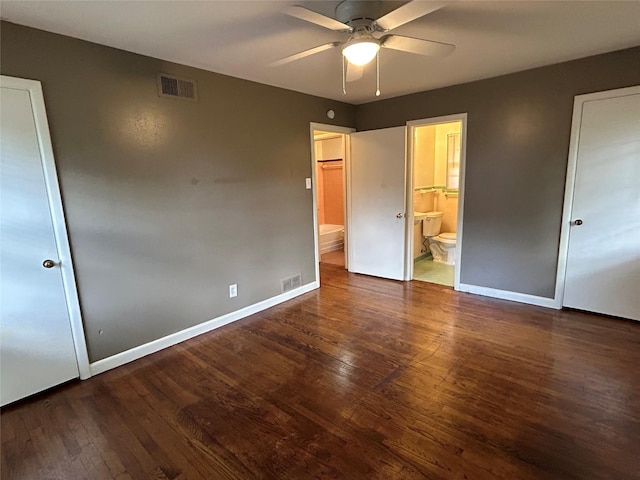 5004 Haywood Pkwy, Dallas, TX 75232 - unfurnished bedroom featuring wood finished floors, baseboards, connected bathroom, and a ceiling fan