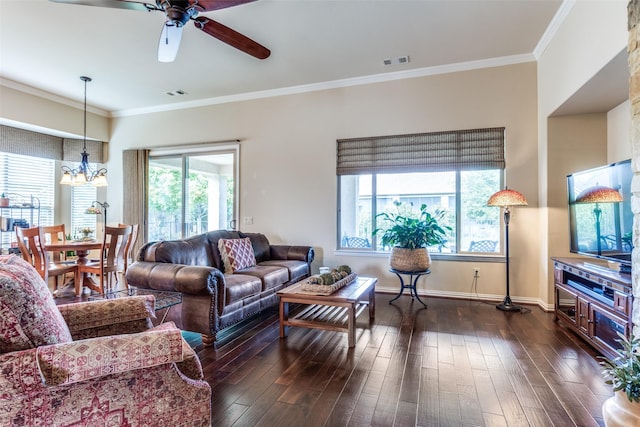 11708 Southerland Dr, Denton, TX 76207 - living area with ceiling fan, a chandelier, crown molding, dark wood-type flooring, and baseboards