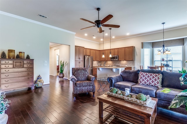 11708 Southerland Dr, Denton, TX 76207 - living area featuring ceiling fan, ornamental molding, dark wood-type flooring, a chandelier, and recessed lighting