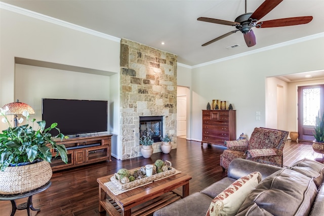 11708 Southerland Dr, Denton, TX 76207 - living area with ornamental molding, a ceiling fan, hardwood / wood-style flooring, and a stone fireplace