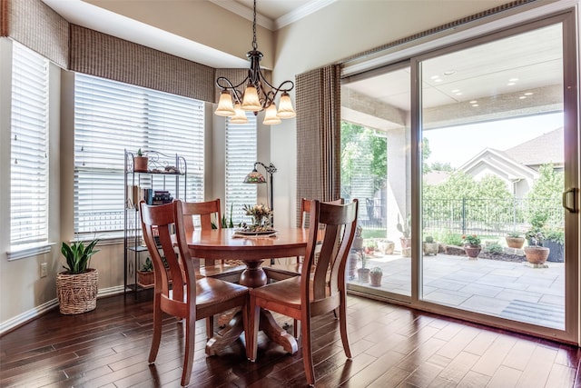 11708 Southerland Dr, Denton, TX 76207 - dining area featuring ornamental molding, wood finished floors, a chandelier, and baseboards