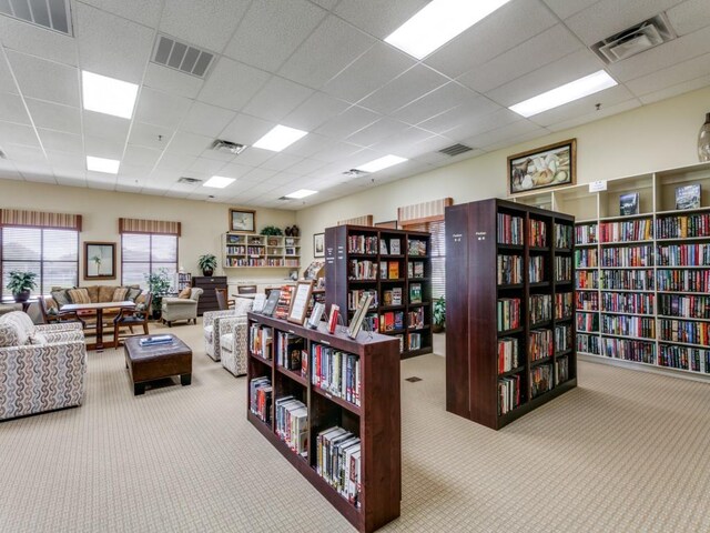 11708 Southerland Dr, Denton, TX 76207 - misc room with bookshelves, carpet floors, and a paneled ceiling
