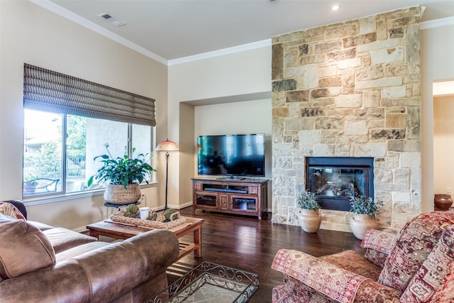 11708 Southerland Dr, Denton, TX 76207 - living room featuring wood finished floors, ornamental molding, baseboards, and a stone fireplace