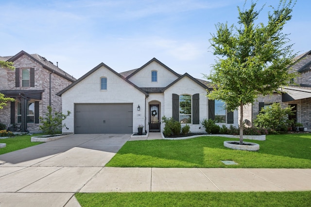 1908 St Andrews Dr, Celina, TX 75009 - french country style house with a front lawn, driveway, and a garage