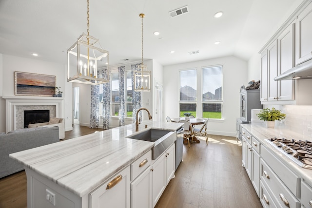 1908 St Andrews Dr, Celina, TX 75009 - kitchen with a sink, baseboards, dark wood-style floors, a kitchen island with sink, and appliances with stainless steel finishes