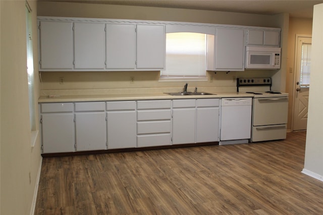 534 N Race St, Stephenville, TX 76401 - kitchen with white appliances, a sink, dark wood finished floors, and baseboards