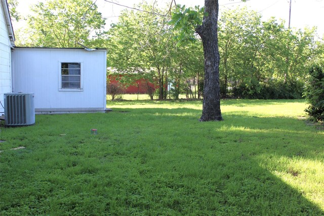 534 N Race St, Stephenville, TX 76401 - view of green lawn featuring central air condition unit