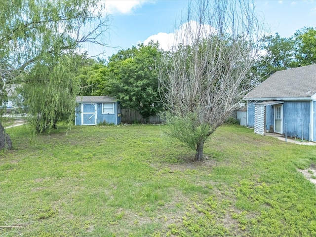 206 Taylor St, Bowie, TX 76230 - view of yard featuring a shed and an outdoor structure