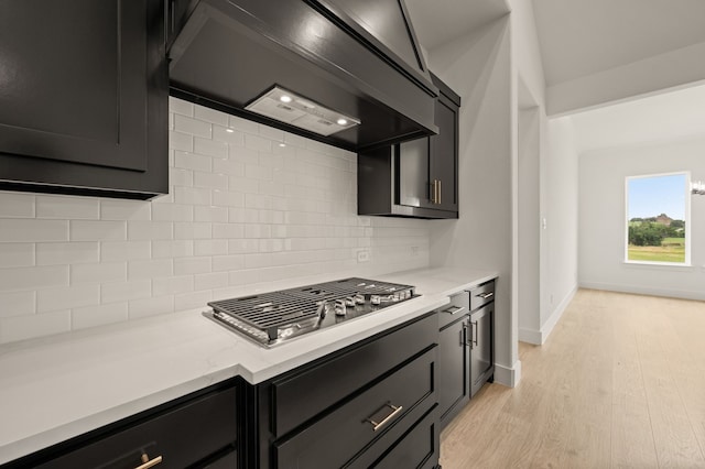 4413 Sandstrom Way, Fort Worth, TX 76179 - kitchen featuring custom exhaust hood, stainless steel gas cooktop, decorative backsplash, light countertops, and light wood finished floors