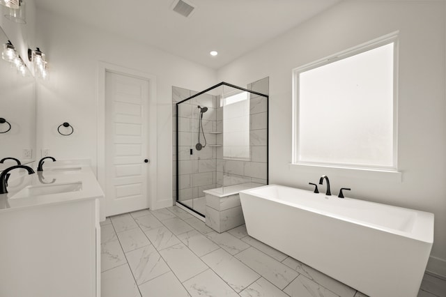 4413 Sandstrom Way, Fort Worth, TX 76179 - full bath with marble finish floors, a freestanding bath, a stall shower, double vanity, and recessed lighting