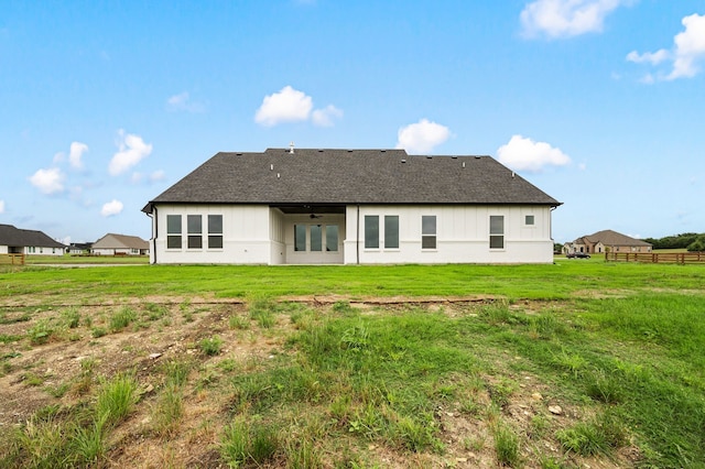 4413 Sandstrom Way, Fort Worth, TX 76179 - rear view of house with ceiling fan, board and batten siding, and roof with shingles