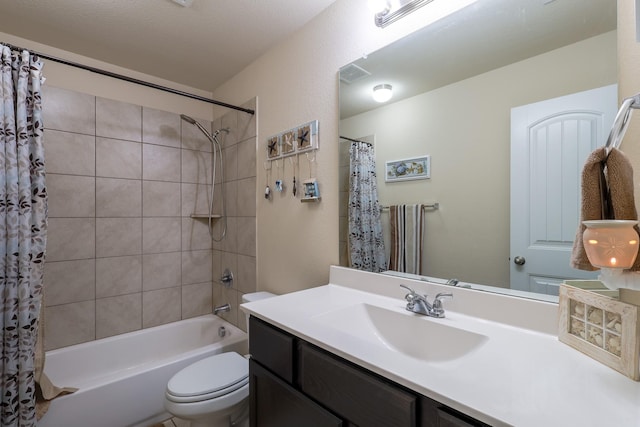 bathroom with toilet, shower / tub combo, and vanity