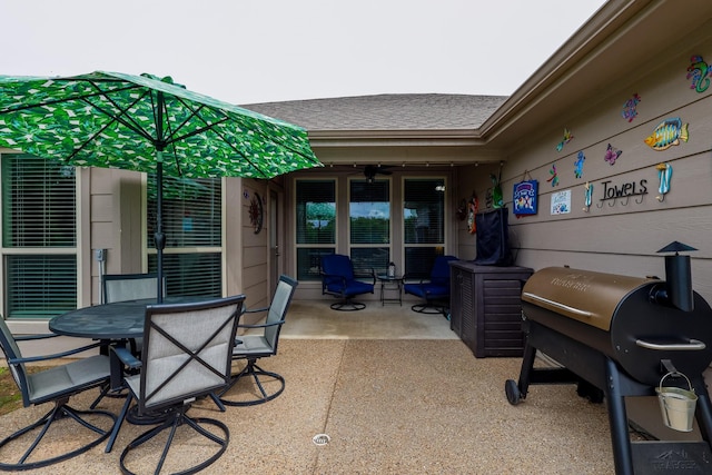 view of patio featuring outdoor dining area