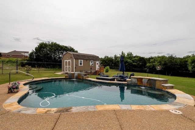 view of pool featuring a shed and an outbuilding