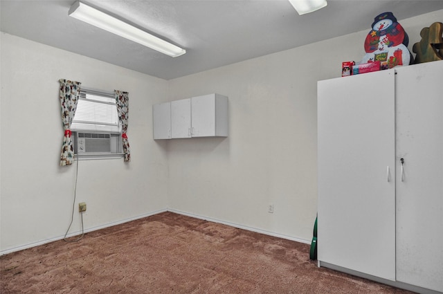 unfurnished bedroom with carpet floors and baseboards