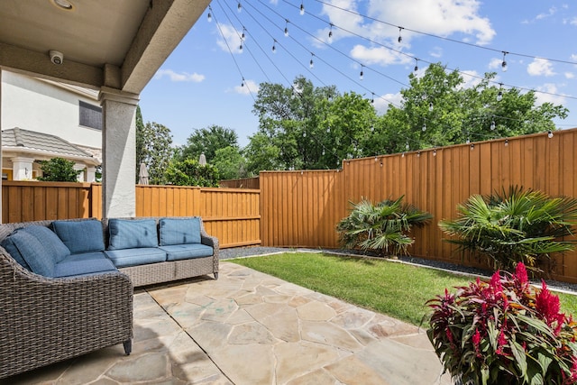2576 Fountain Cv, Carrollton, TX 75006 - view of patio with an outdoor living space and a fenced backyard