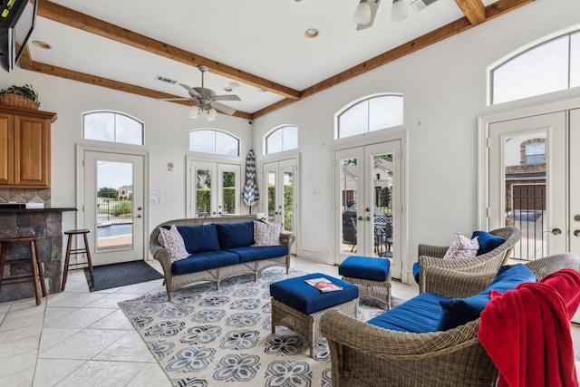 2576 Fountain Cv, Carrollton, TX 75006 - living room with french doors, ceiling fan, beam ceiling, healthy amount of natural light, and a towering ceiling