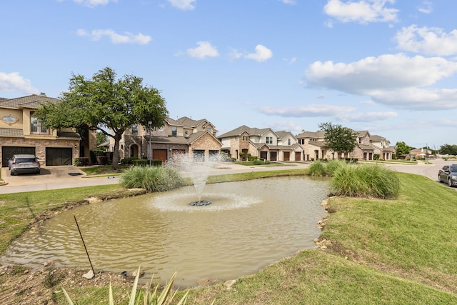 2576 Fountain Cv, Carrollton, TX 75006 - view of community featuring a residential view, a water view, a yard, and an attached garage