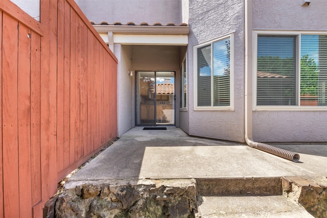 4242 N Capistrano Dr Unit 161, Dallas, TX 75287 - doorway to property with a patio and stucco siding