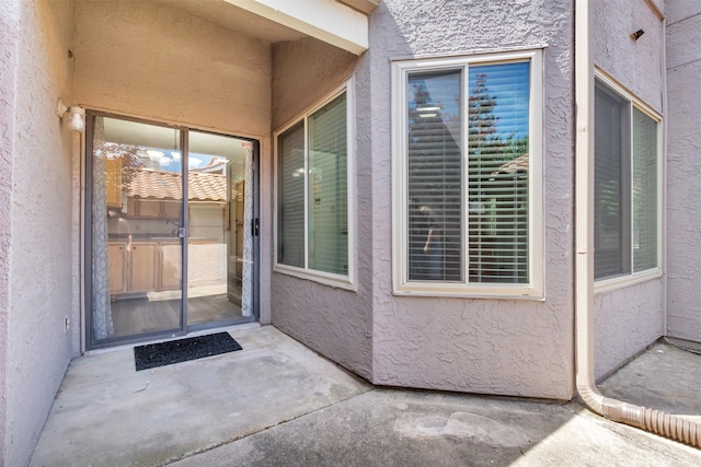 4242 N Capistrano Dr Unit 161, Dallas, TX 75287 - view of exterior entry with stucco siding