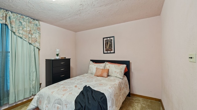 529 Proctor Ave, Waco, TX 76708 - carpeted bedroom featuring baseboards and a textured ceiling