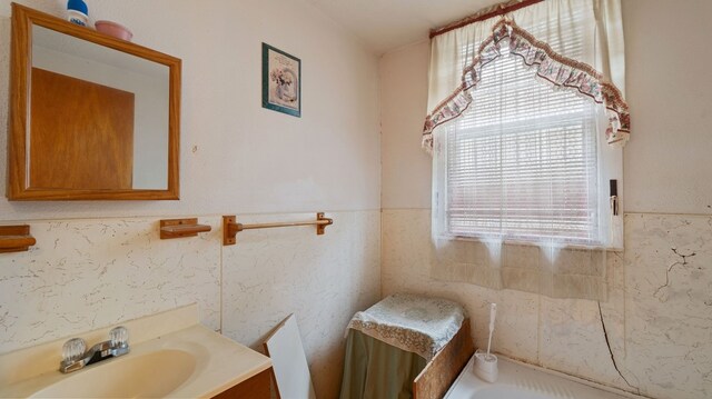 529 Proctor Ave, Waco, TX 76708 - bathroom featuring a wainscoted wall and vanity