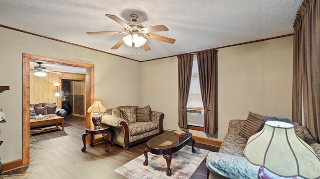 529 Proctor Ave, Waco, TX 76708 - living area featuring crown molding, a ceiling fan, wood finished floors, a textured ceiling, and baseboards