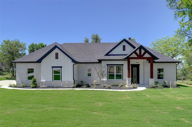 316 Falcon Ct, Springtown, TX 76082 - modern farmhouse featuring board and batten siding, brick siding, a front lawn, and roof with shingles