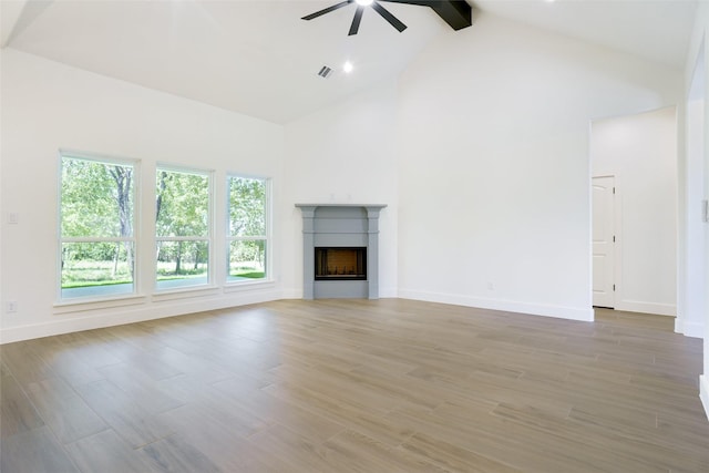 316 Falcon Ct, Springtown, TX 76082 - unfurnished living room featuring ceiling fan, high vaulted ceiling, a fireplace, beam ceiling, and baseboards