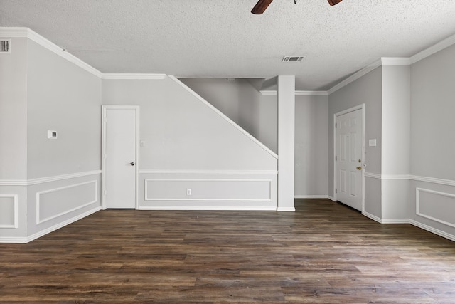 2118 W E Roberts Dr, Grand Prairie, TX 75051 - unfurnished room featuring a ceiling fan, dark wood-type flooring, a textured ceiling, stairway, and ornamental molding