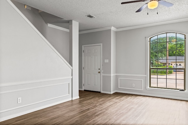 2118 W E Roberts Dr, Grand Prairie, TX 75051 - entryway with wood finished floors, ceiling fan, a textured ceiling, and crown molding