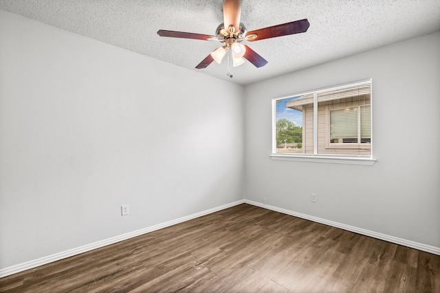 2118 W E Roberts Dr, Grand Prairie, TX 75051 - empty room with wood finished floors, baseboards, a ceiling fan, and a textured ceiling
