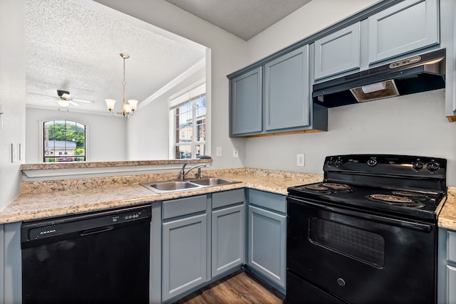 2118 W E Roberts Dr, Grand Prairie, TX 75051 - kitchen featuring black appliances, under cabinet range hood, a textured ceiling, a sink, and light countertops