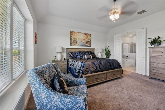 5009 Chisholm View Dr, Fort Worth, TX 76123 - carpeted bedroom featuring multiple windows, ensuite bathroom, a ceiling fan, and vaulted ceiling