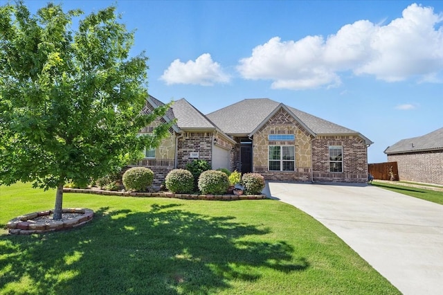 5009 Chisholm View Dr, Fort Worth, TX 76123 - view of front of house with concrete driveway, an attached garage, a front lawn, a shingled roof, and brick siding