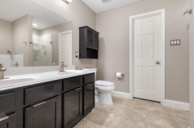 12604 Ocean Spray Dr, Frisco, TX 75036 - full bathroom featuring a stall shower, toilet, double vanity, and baseboards