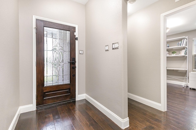 12604 Ocean Spray Dr, Frisco, TX 75036 - foyer entrance featuring dark wood-style flooring, healthy amount of natural light, and baseboards