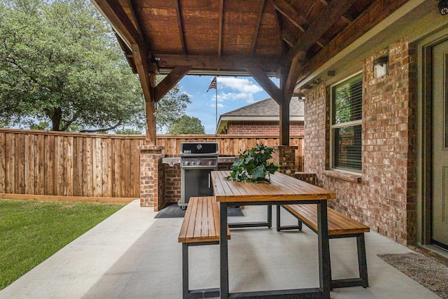 12604 Ocean Spray Dr, Frisco, TX 75036 - view of patio featuring exterior kitchen, outdoor dining space, fence, and a grill
