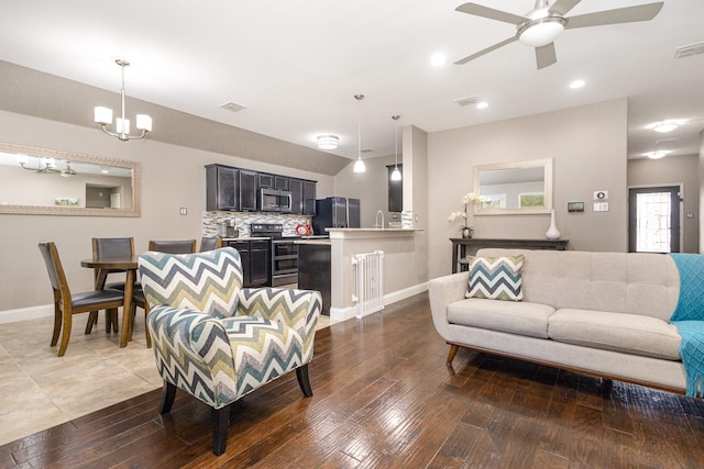 12604 Ocean Spray Dr, Frisco, TX 75036 - living area with a ceiling fan, baseboards, hardwood / wood-style floors, recessed lighting, and a chandelier