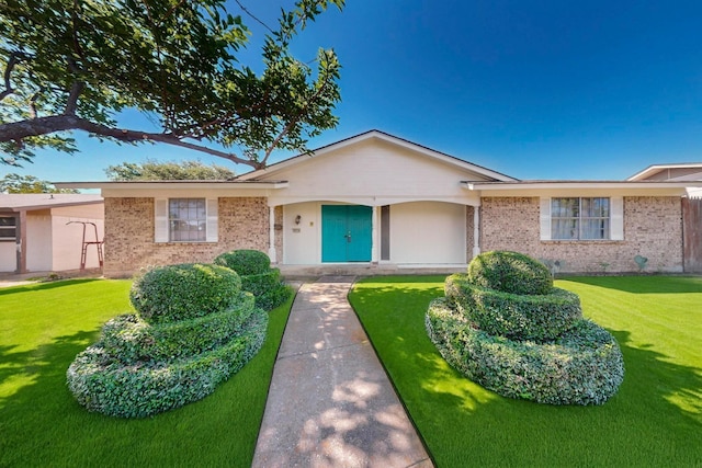 3714 Burning Tree Ln, Garland, TX 75042 - ranch-style house with brick siding and a front yard