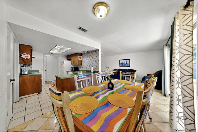 3714 Burning Tree Ln, Garland, TX 75042 - dining space featuring light tile patterned floors
