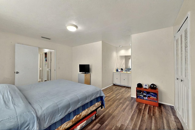 3714 Burning Tree Ln, Garland, TX 75042 - bedroom featuring wood finished floors and baseboards