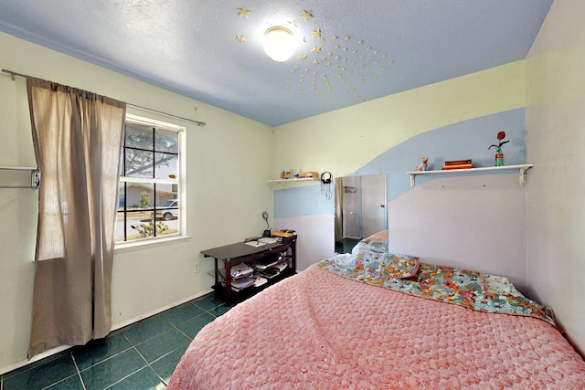 3714 Burning Tree Ln, Garland, TX 75042 - bedroom featuring dark tile patterned floors