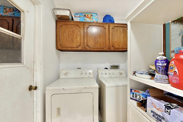 3714 Burning Tree Ln, Garland, TX 75042 - laundry room with washer and clothes dryer and cabinet space