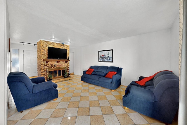3714 Burning Tree Ln, Garland, TX 75042 - living room featuring light tile patterned floors and a fireplace